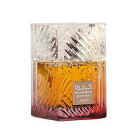Decorative glass container with intricate designs on a white background