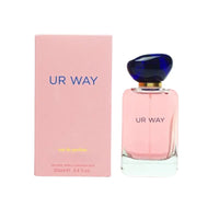 Pink 'UR WAY' perfume bottle and packaging on a white background