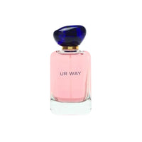 Perfume bottle with pink body and blue cap on a white background