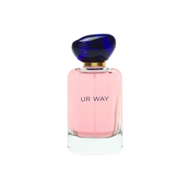 Perfume bottle with pink body and blue cap on a white background