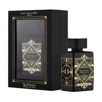 Black and gold perfume bottle with decorative packaging on a white background