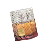 Perfume bottle with a textured design on a white background