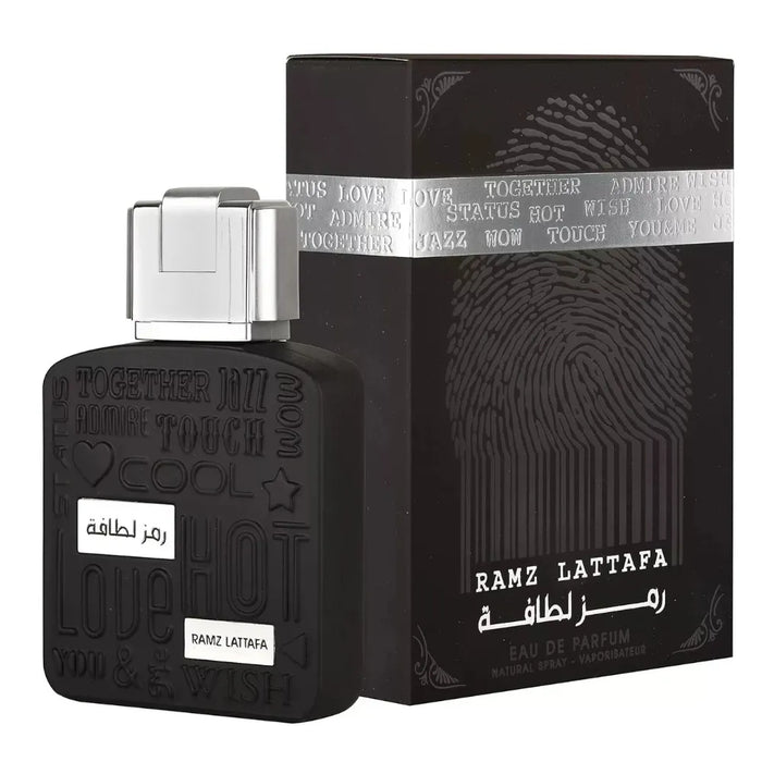 Black perfume bottle and packaging with 'RAMZ LATTafa' branding on a white background