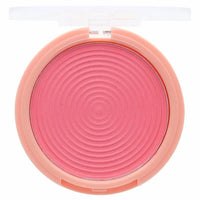Pink blush compact with a clear lid on a white background