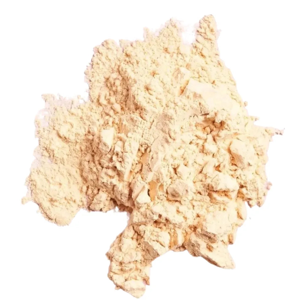 Clump of beige powder on a white background