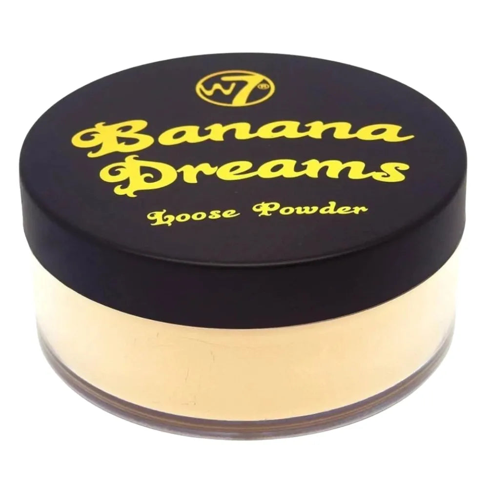 W7 Banana Dreams loose powder container with black lid and gold body on a white background