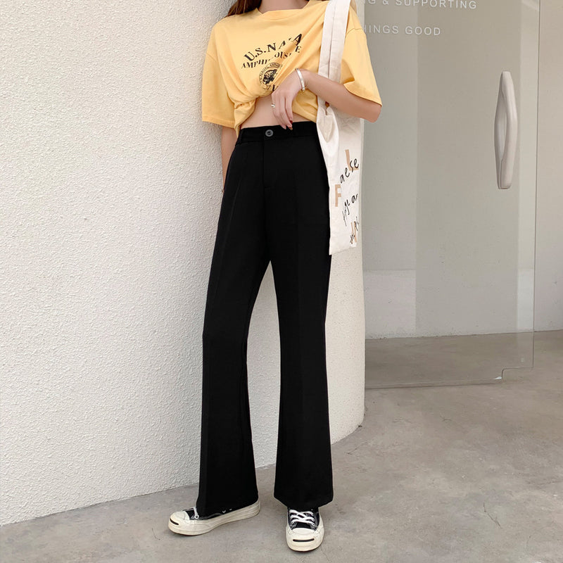 Tall Woman With Long Slit Suit Pants Was Thin